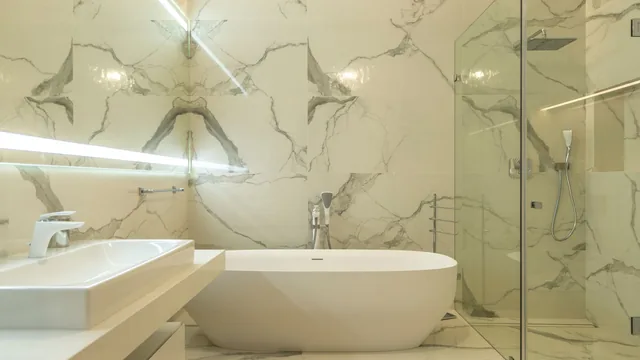 Tile setter finishing a shower wall in Anaheim, CA